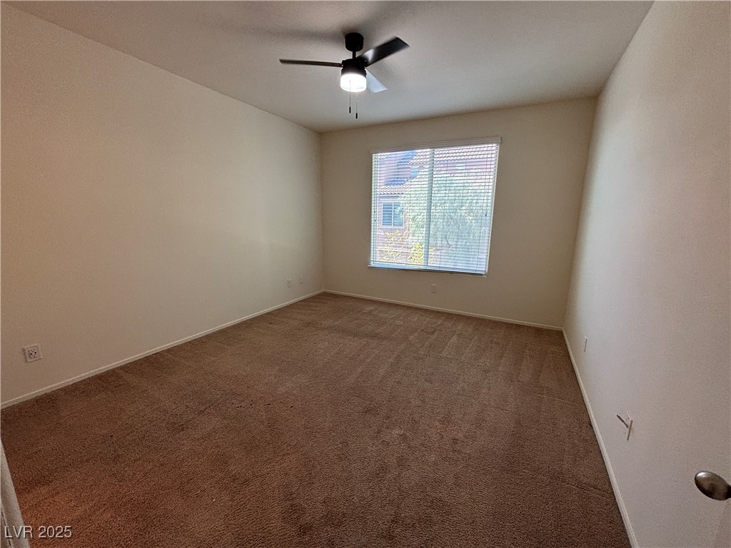 4512 Townwall Street Las Vegas, NV 89115 - Photo 22 of 56 Empty room with carpet flooring and ceiling fan