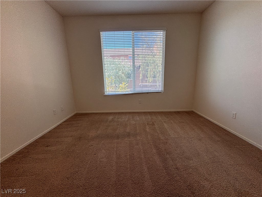 4512 Townwall Street Las Vegas, NV 89115 - Photo 23 of 56 Carpeted spare room with a textured wall