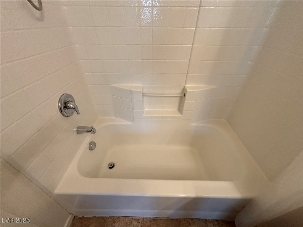 4512 Townwall Street Las Vegas, NV 89115 - Photo 30 of 56 Full bath featuring bathtub / shower combination and tile patterned floors