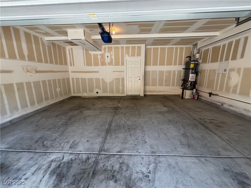 4512 Townwall Street Las Vegas, NV 89115 - Photo 5 of 56 Garage featuring strapped water heater