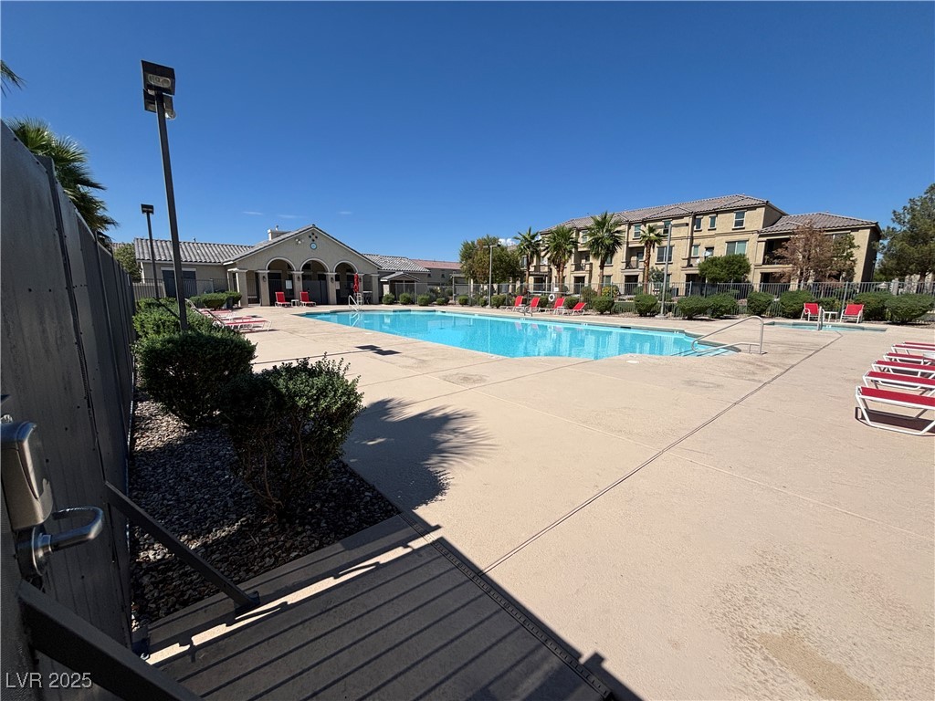 4512 Townwall Street Las Vegas, NV 89115 - Photo 54 of 56 Community pool with a patio