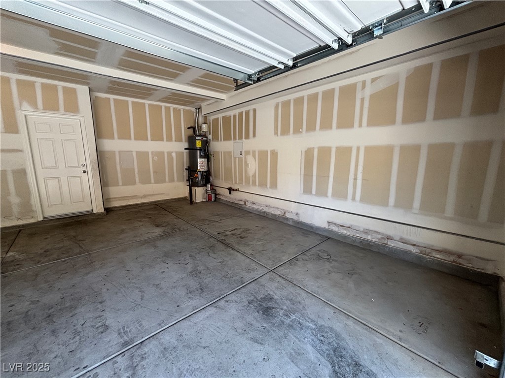 4512 Townwall Street Las Vegas, NV 89115 - Photo 6 of 56 Garage with strapped water heater