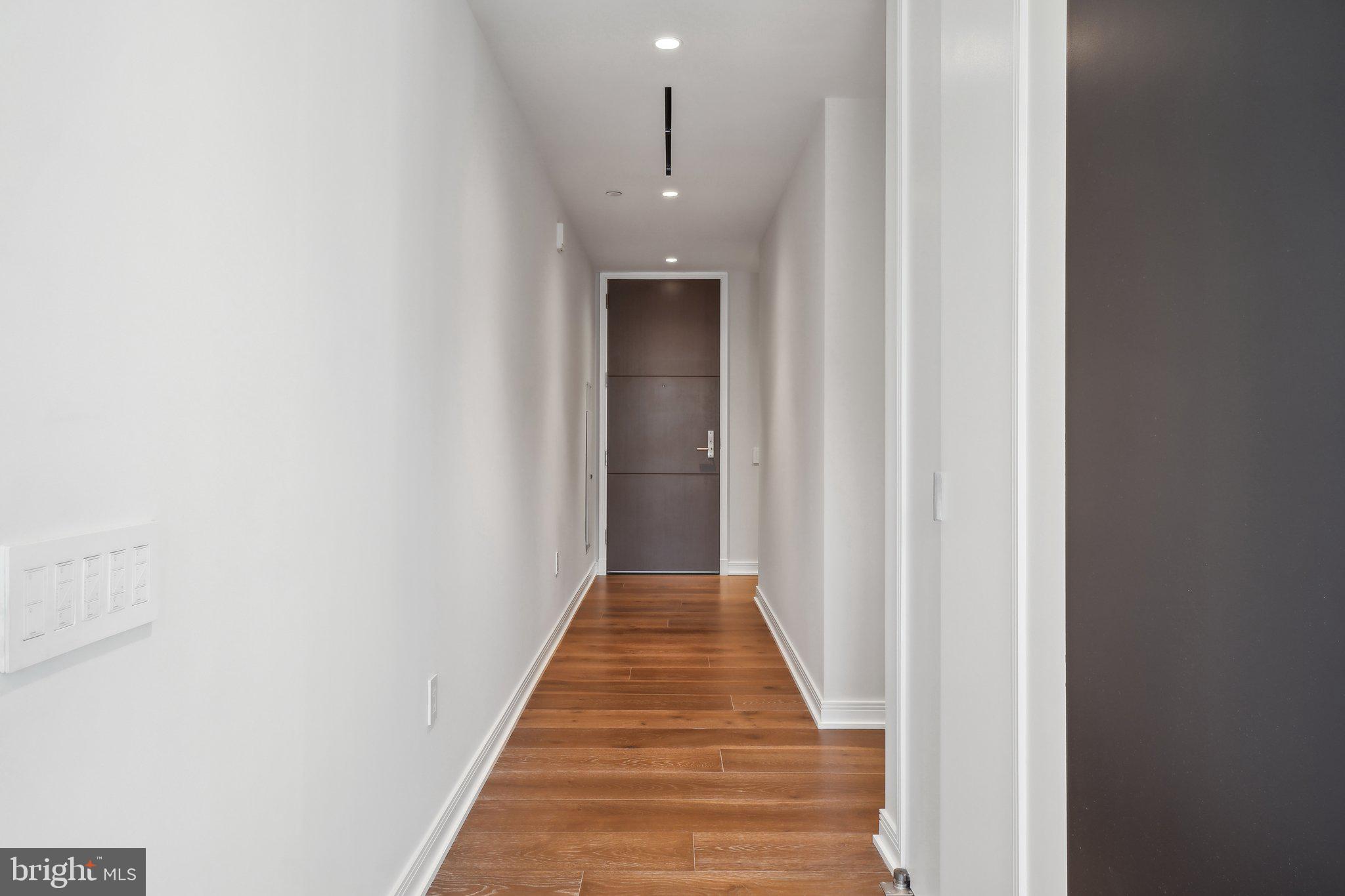 601 Wharf Street Southwest, Unit 213 Washington, DC 20024 - Photo 12 of 23 a view of a hallway with wooden floor and staircase