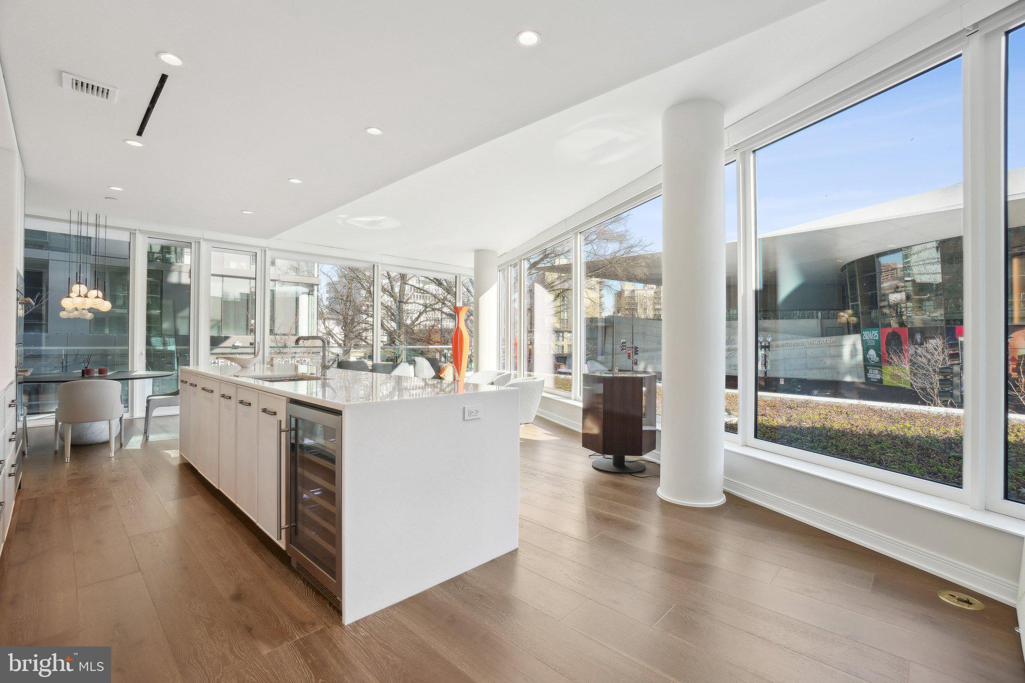 601 Wharf Street Southwest, Unit 213 Washington, DC 20024 - Photo 4 of 23 a large white kitchen with a large window