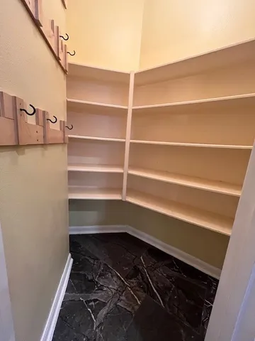a storage room with wooden floor