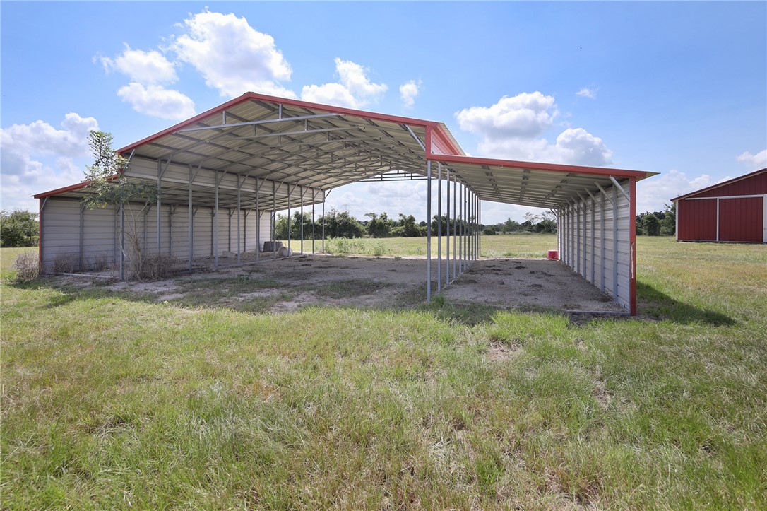 7808 Oxford Cemetery Road Madisonville, TX 77864 - Photo 9 of 41 View of parking / parking lot with a detached carp