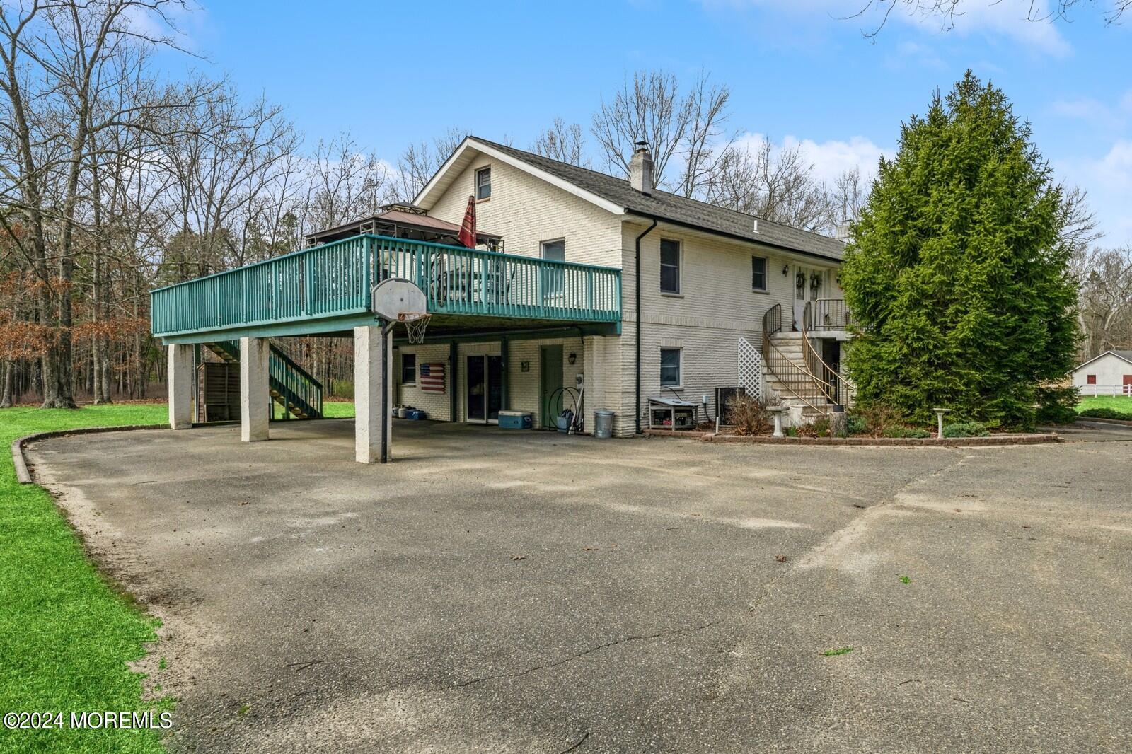 105 Buckingham Road Whiting, NJ 08759 - Photo 6 of 59 a view of a house with a yard and garage