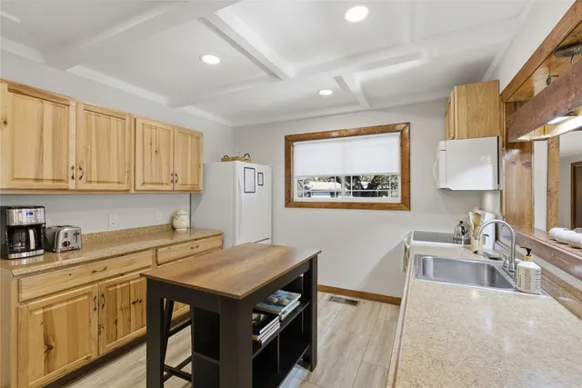 a view of a kitchen with furniture and staircase