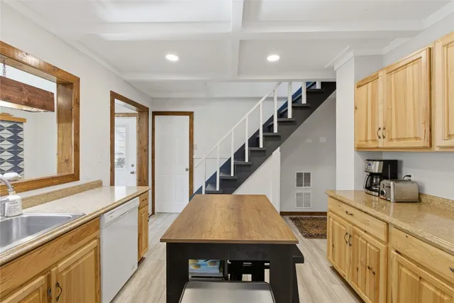 a view of a dining room with furniture and window