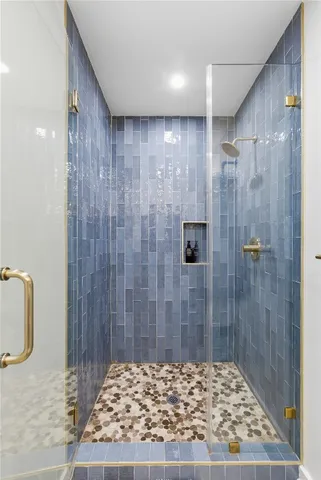 a view of entryway with furniture and chandelier