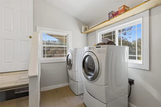a view of a chairs and table in a balcony