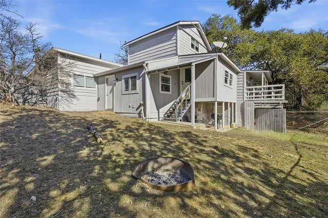 a room with pool table and windows