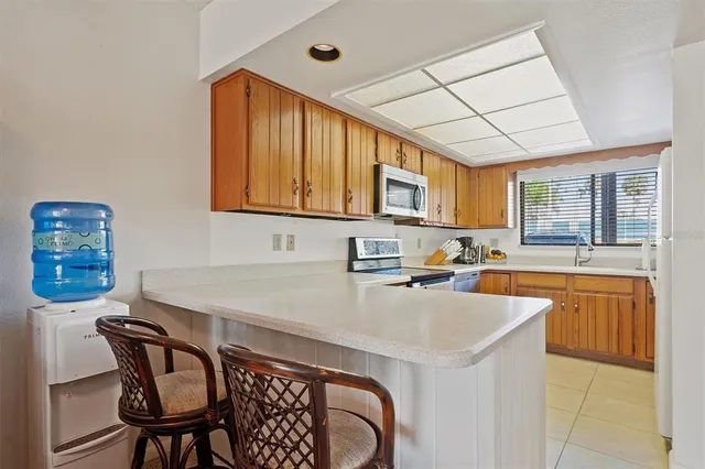 a kitchen that has a cabinets counter space and appliances