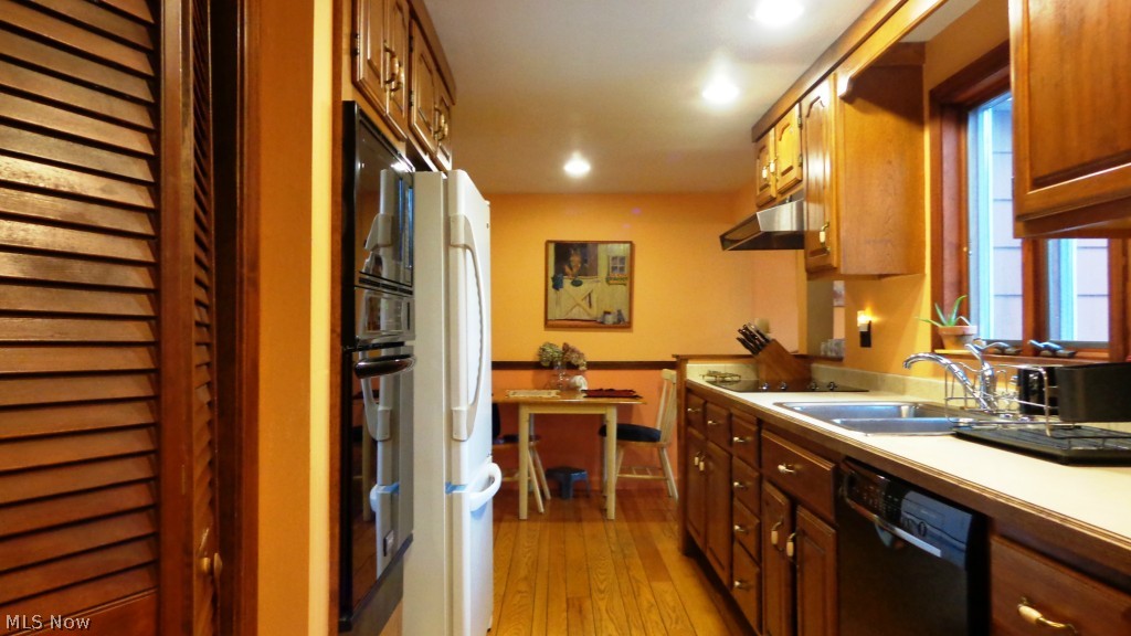 8380 Dines Road Novelty, OH 44072 - Photo 5 of 19 kitchen has a pantry, and newer oven, convection oven and microwave, counter top range, and dishwasher