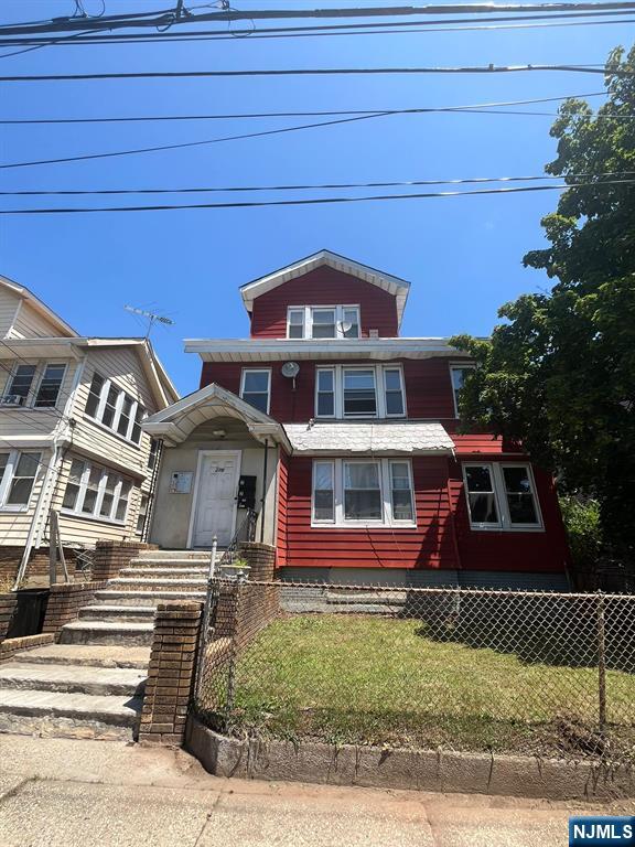 281 Renner Avenue, Unit 279 Newark, NJ 07112 - Photo 1 of 12 a front view of a house with garden