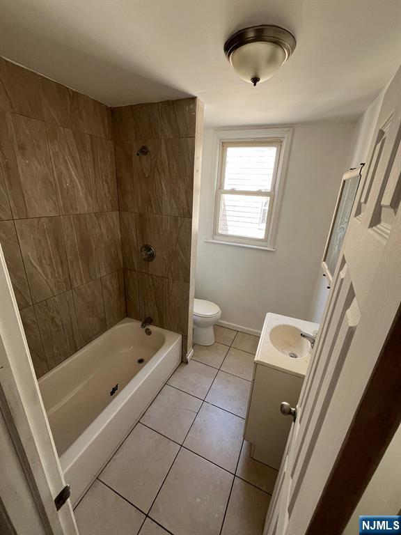 281 Renner Avenue, Unit 279 Newark, NJ 07112 - Photo 12 of 12 a bathroom with a tub a sink and a shower
