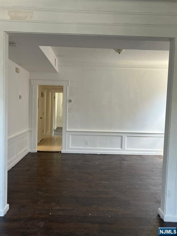 281 Renner Avenue, Unit 279 Newark, NJ 07112 - Photo 4 of 12 a view of empty room with wooden floor