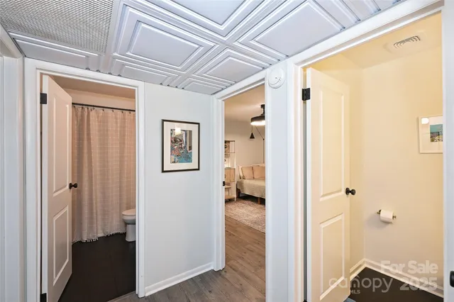 a view of a hallway with a white walls