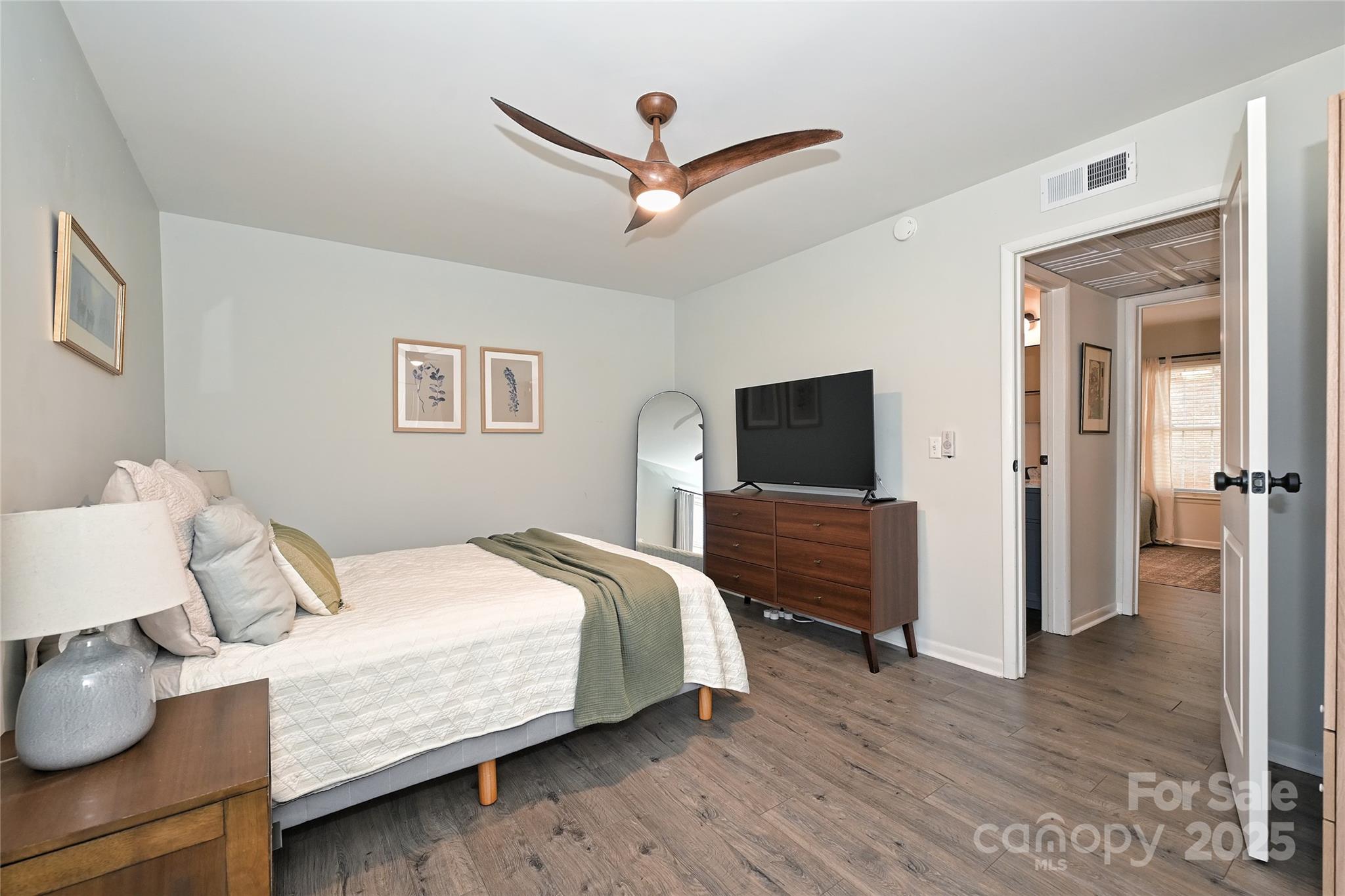 2604 Park Road, Unit B Charlotte, NC 28209 - Photo 14 of 21 a bedroom with a bed and a flat screen tv