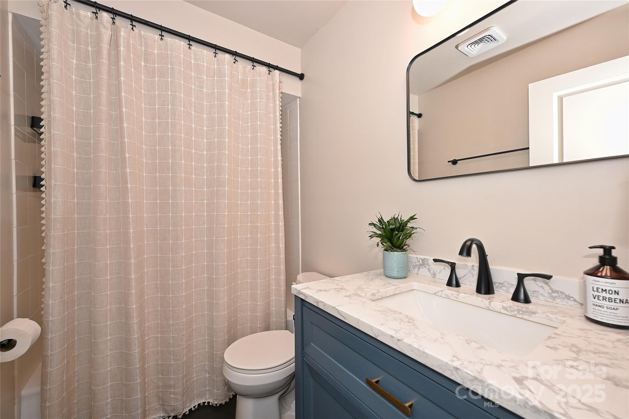 2604 Park Road, Unit B Charlotte, NC 28209 - Photo 15 of 21 a bathroom with a granite countertop sink and a mirror