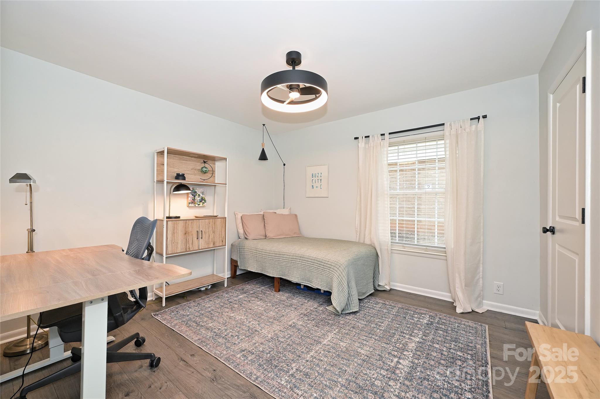 2604 Park Road, Unit B Charlotte, NC 28209 - Photo 16 of 21 a bedroom with a bed and wooden floor