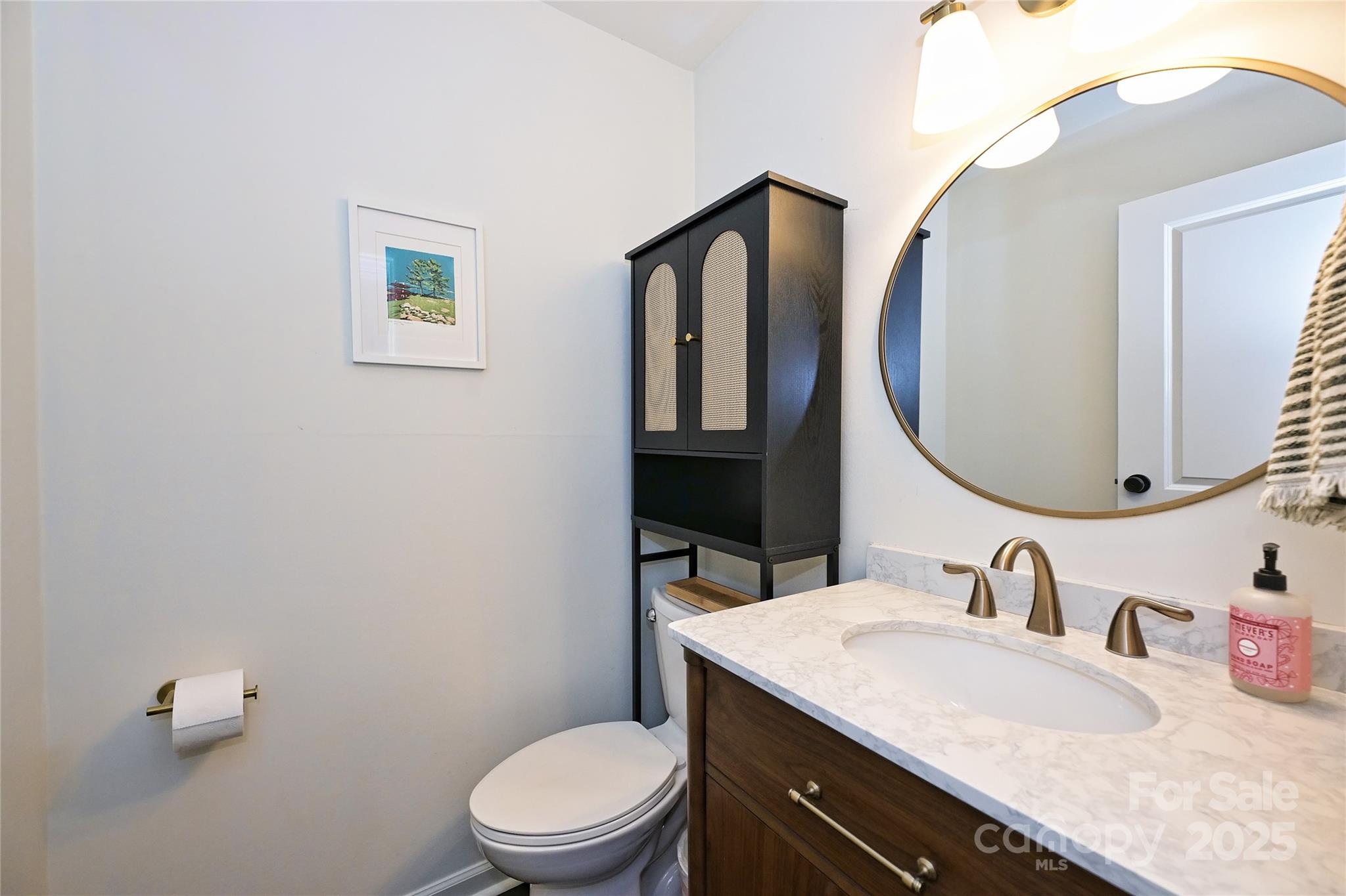 2604 Park Road, Unit B Charlotte, NC 28209 - Photo 17 of 21 a bathroom with a granite countertop toilet a sink and mirror