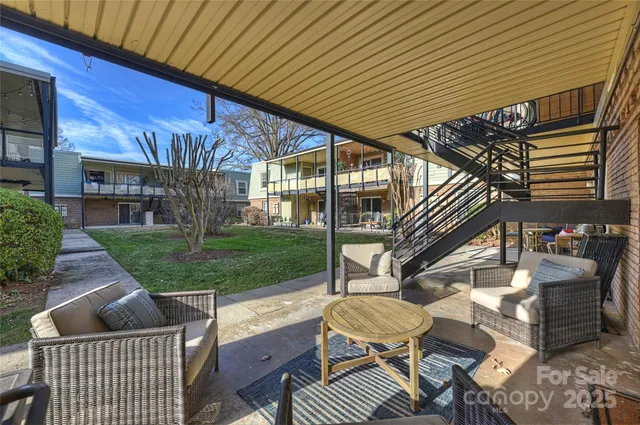 a view of yard with patio