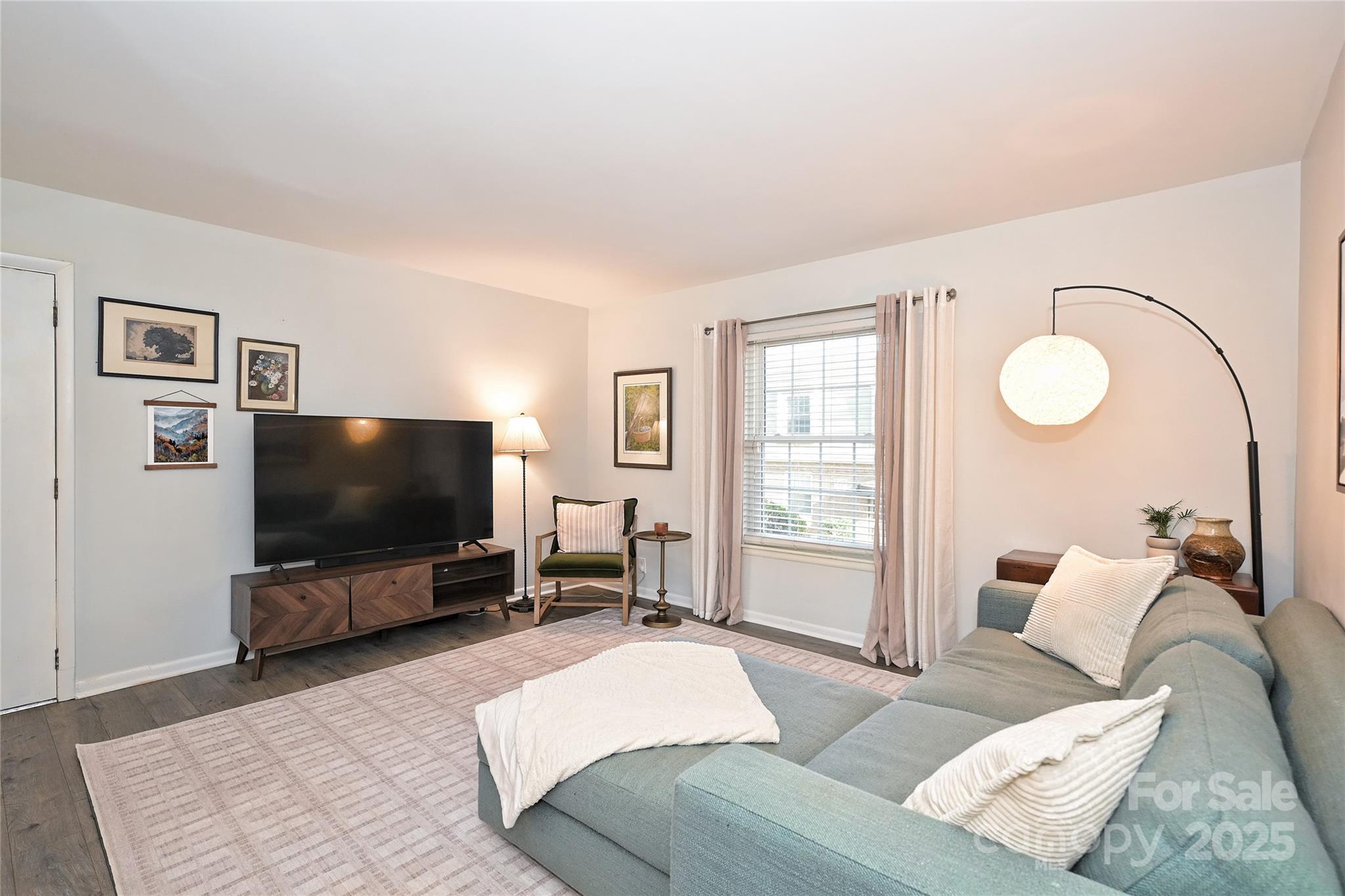 2604 Park Road, Unit B Charlotte, NC 28209 - Photo 2 of 21 a living room with furniture and a flat screen tv