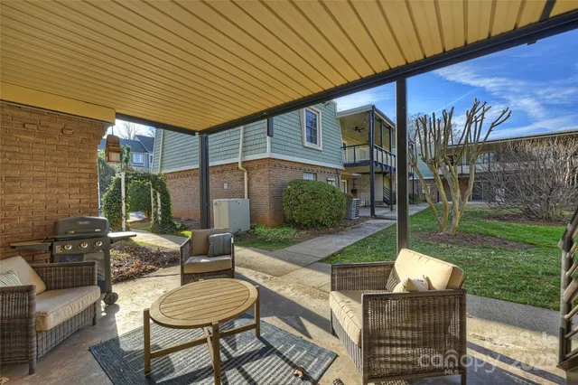 a backyard of a house with outdoor seating