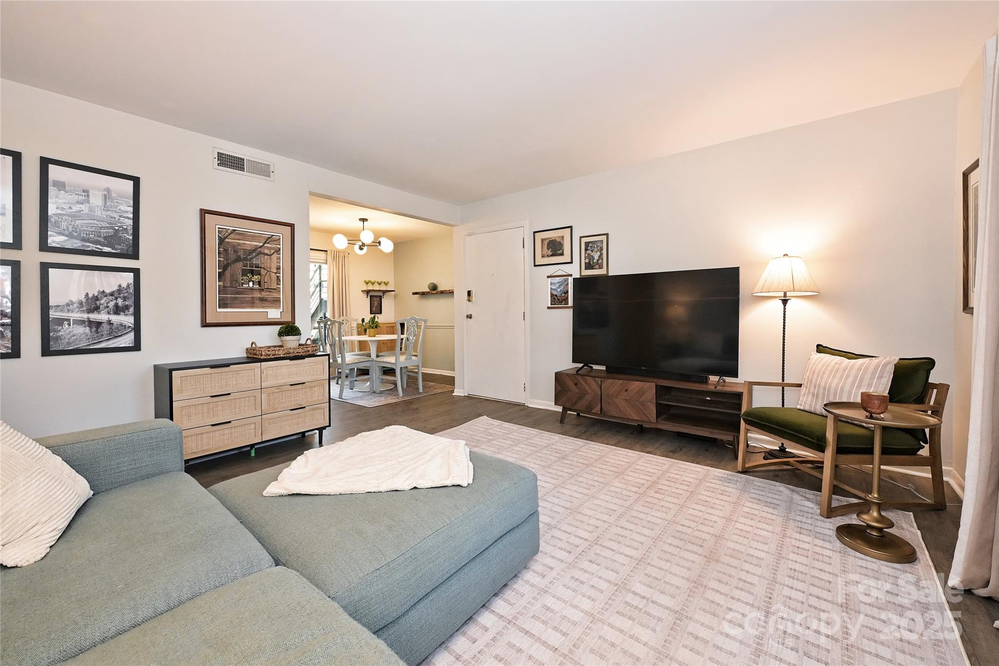 2604 Park Road, Unit B Charlotte, NC 28209 - Photo 3 of 21 a living room with furniture and a flat screen tv