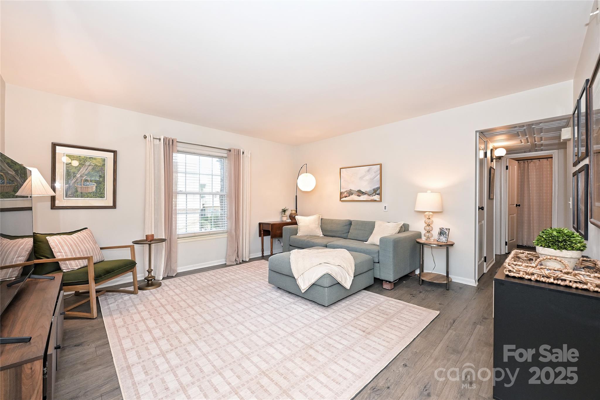 2604 Park Road, Unit B Charlotte, NC 28209 - Photo 4 of 21 a bedroom with a bed and wooden floor