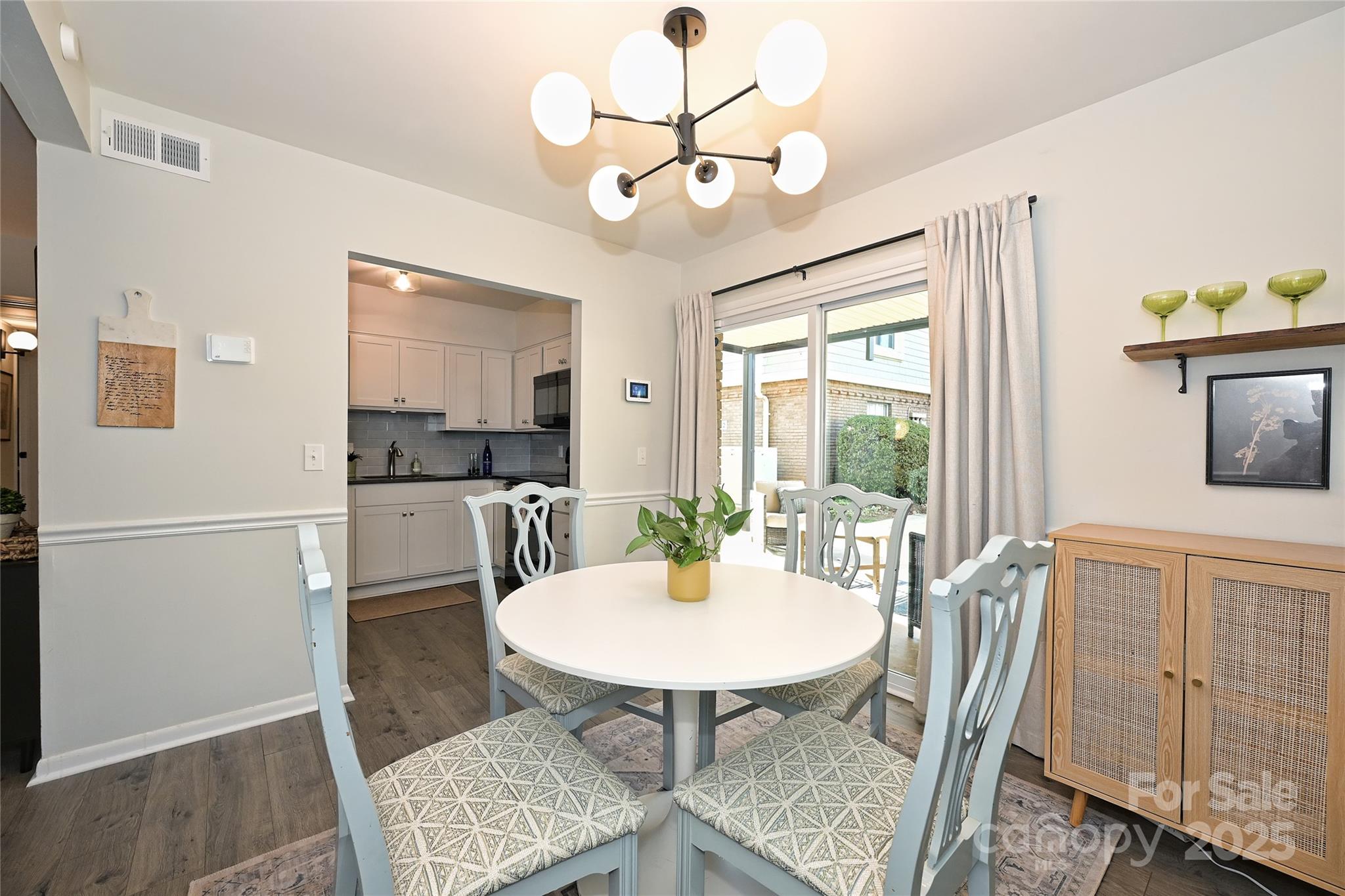 2604 Park Road, Unit B Charlotte, NC 28209 - Photo 6 of 21 a view of a dining room with furniture window and wooden floor