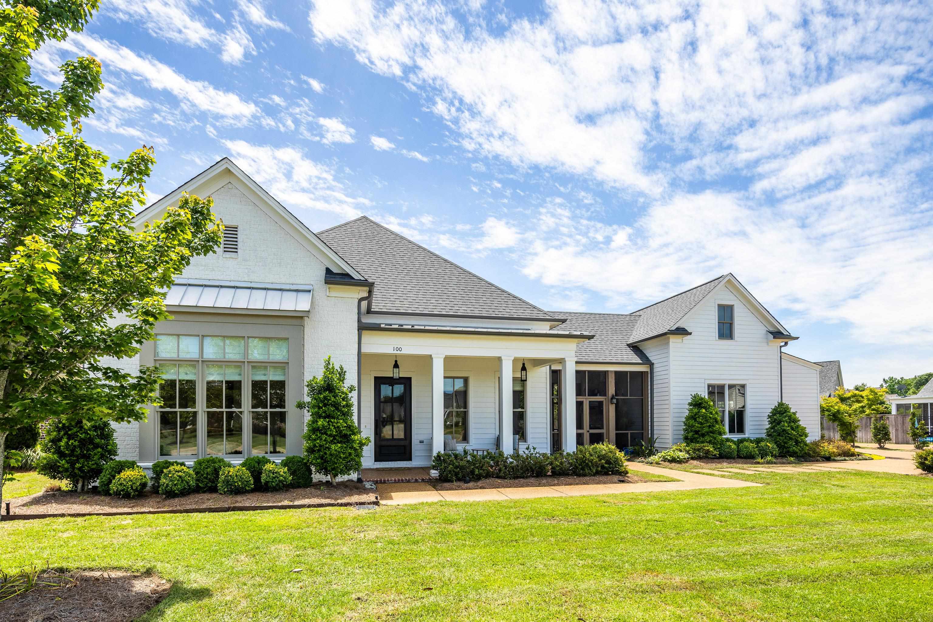 100 Sunflower View Road Piperton, TN 38017 - Photo 1 of 29 Elegant white brick and siding exterior with a dark shingle roof