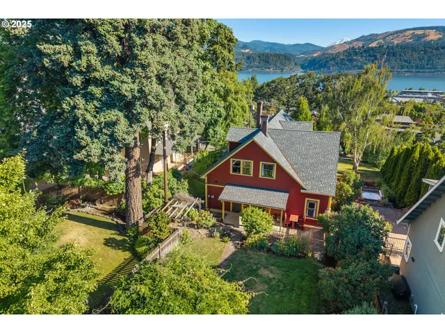 a aerial view of a house with a yard