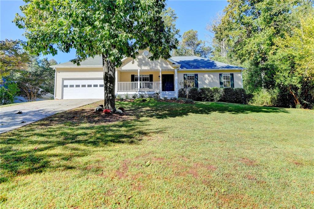6810 Payton Road Cumming, GA 30041 - Photo 1 of 1 a front view of a house with a yard