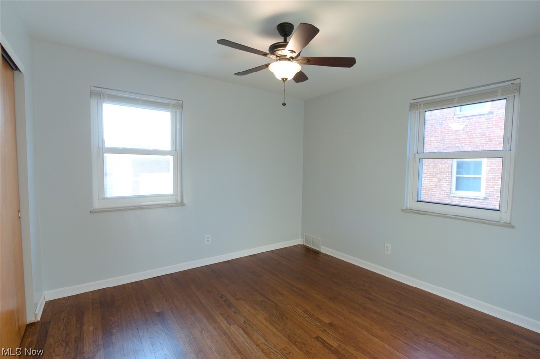 6462 Ridge Road Parma, OH 44129 - Photo 13 of 24 Spare room with dark hardwood / wood-style flooring and ceiling fan