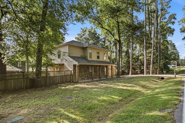 13396 Teel Road Montgomery, TX 77356 - Photo 4 of 50 a front view of a house with a garden