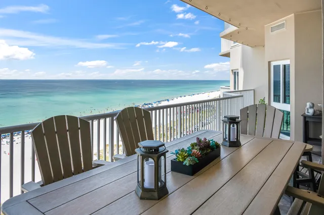 a bedroom with a large bed and a large window