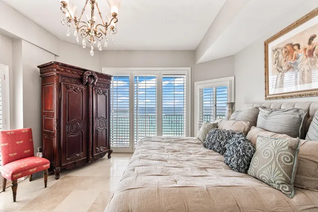 a living room with furniture kitchen view and a flat screen tv