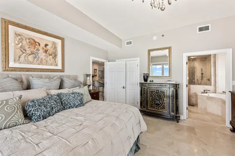 a bedroom with a bed and a couch