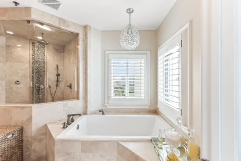 a bedroom with a bed and flat screen tv