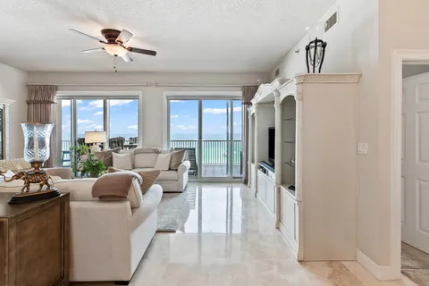 a view of a balcony with wooden benches