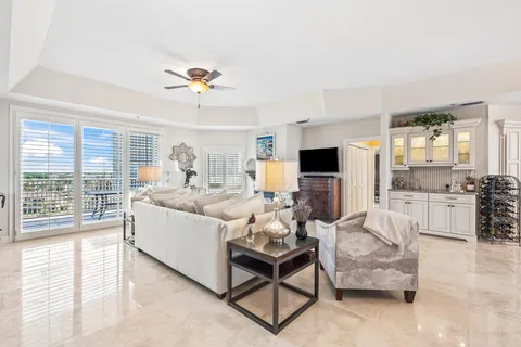 a living room with furniture fireplace and a window