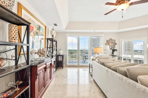 a dining room with furniture and chandelier