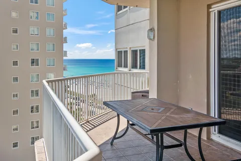 a lobby with furniture and a glass door shower