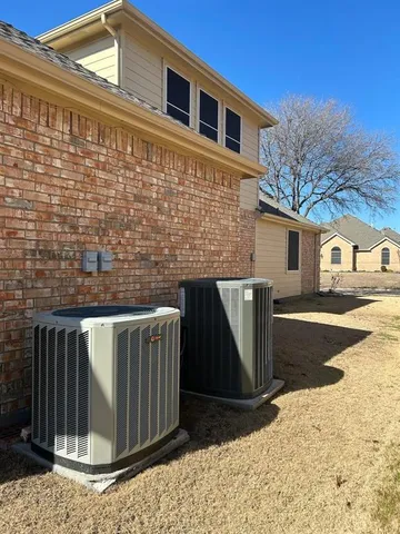 a view of a backyard with wooden fence