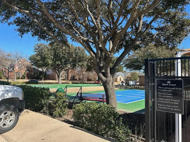 a view of a garden with wooden fence