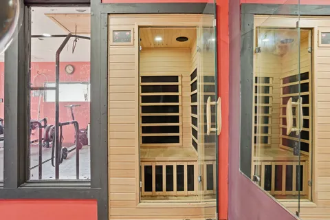 a front view of a building with a door and a window