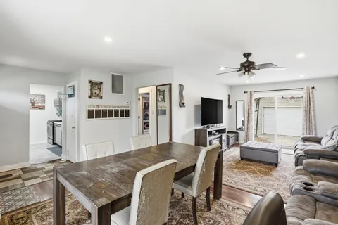 a view of a livingroom with furniture and a flat screen tv