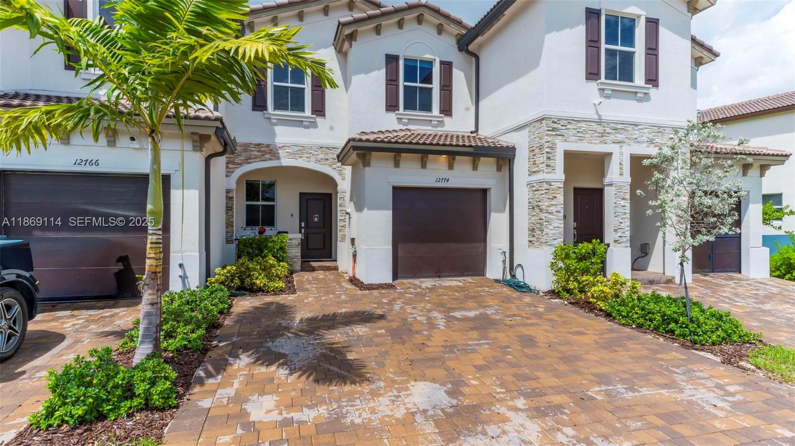 a front view of a house with garden
